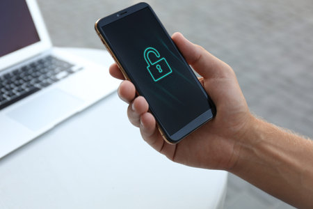 Privacy protection. Man unlocking mobile phone, closeup
