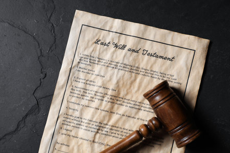 Last Will and Testament and gavel on black table, top viewの写真素材