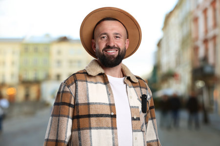 Man with hidden spy camera in his pocket on city street outdoorsの写真素材