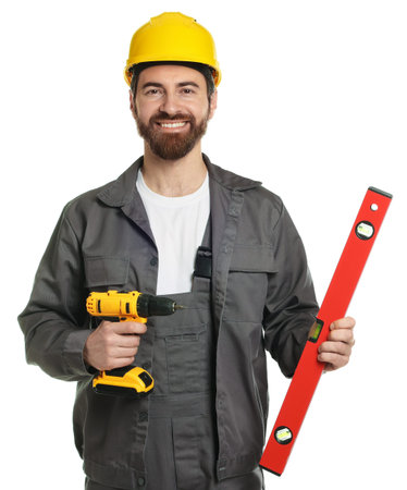 Professional builder with drill and level on white background