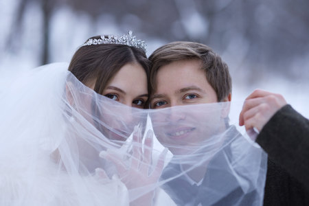 Happy newlywed couple outdoors on winter dayの写真素材