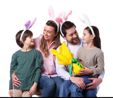 Happy Easter. Family with bunny ears and wrapped egg on white backgroundの写真素材
