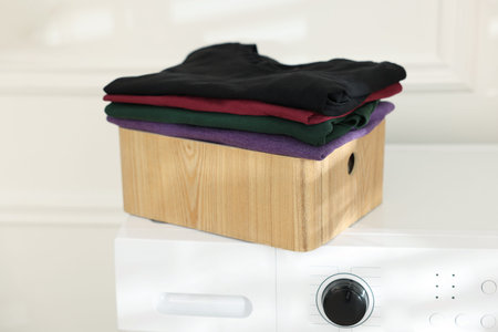 Clean in laundry crate on washing machine indoors, closeupの写真素材