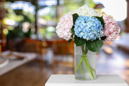 Bouquet of beautiful hydrangea flowers on table in restaurantの写真素材