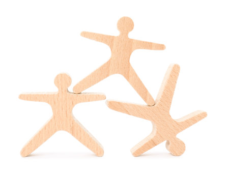 Wooden stacking acrobats isolated on white. Balancing gameの写真素材