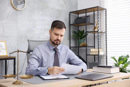 Notary working at wooden desk in office