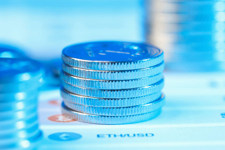 Stacks of coins on chart against blurred background, closeupの写真素材