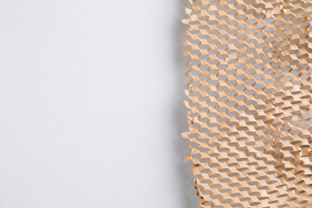 Honeycomb kraft paper on light gray background, top view. Space for textの写真素材