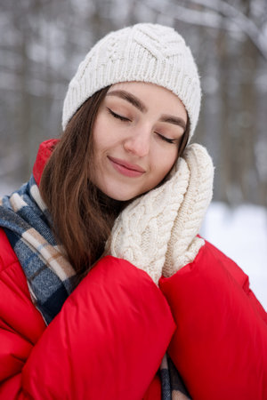 Portrait of beautiful woman in snowy forest