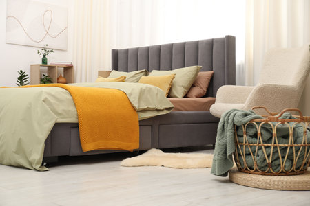 Comfortable bed with stylish lines at home. Interior designの写真素材