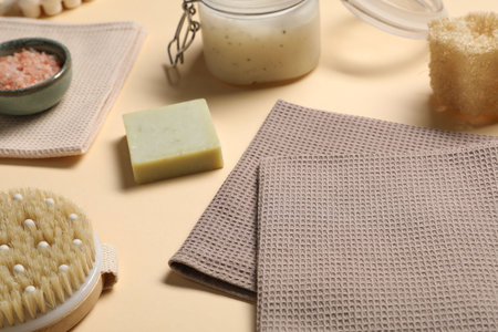 Clean waffle towels and personal care products on beige background, closeupの写真素材