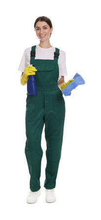 Smiling cleaning service worker with spray bottle and rag on white backgroundの写真素材