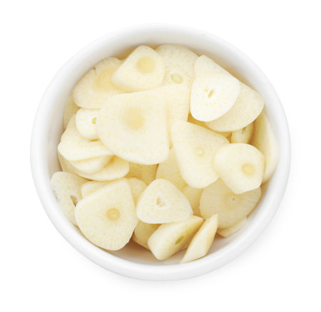 Pieces of fresh garlic in bowl isolated on white, top viewの写真素材