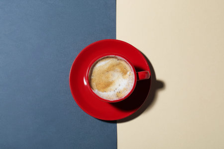 Cup of aromatic coffee on color background, top viewの写真素材