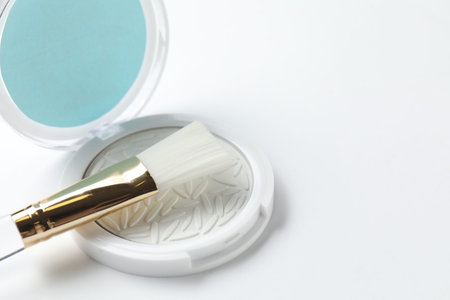 Highlighter with brush on white background, closeup. Space for textの写真素材