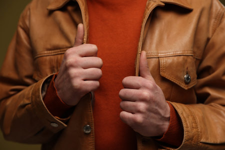Man in leather jacket on color background, closeupの写真素材