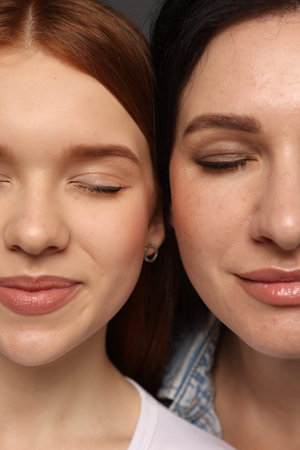 Beautiful mother and her teenage daughter, closeup