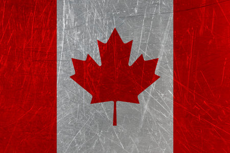 Maple leaf on scratched metal surface as backgroundの写真素材