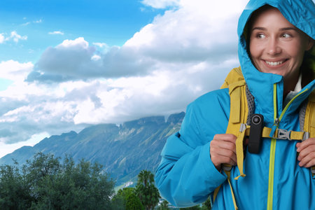 Woman with camera and backpack in mountains