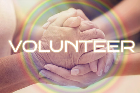 Volunteer and elderly woman holding hands, closeupの写真素材