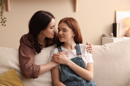Mother and her teenage daughter at home