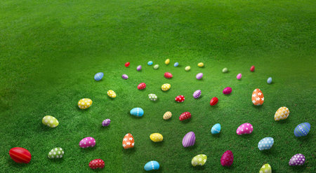 Easter eggs scattered in green grass. Holiday traditional game - egg hunt