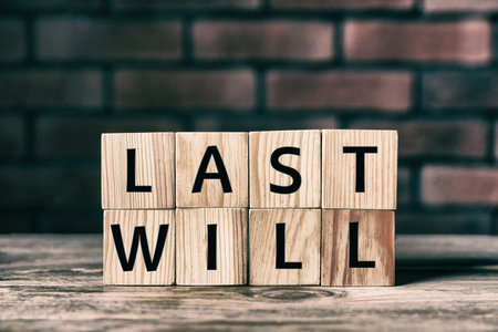 Words Last Will made of wooden cubes with letters on tableの写真素材