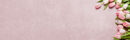 Beautiful tulips on pink table, top view. Banner design with space for textの写真素材