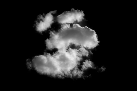 Fluffy white clouds floating on black background