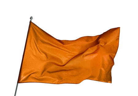 Bright orange flag waving against white background