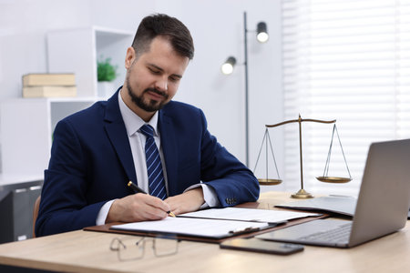 Notary working at wooden desk in office