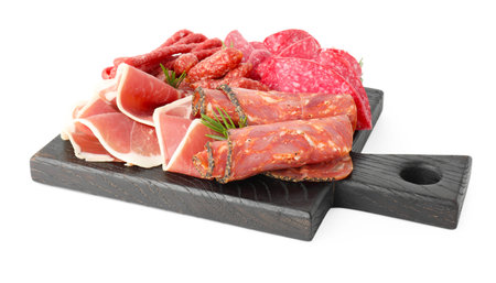 Charcuterie board with different cured meat, sausages and rosemary isolated on whiteの写真素材