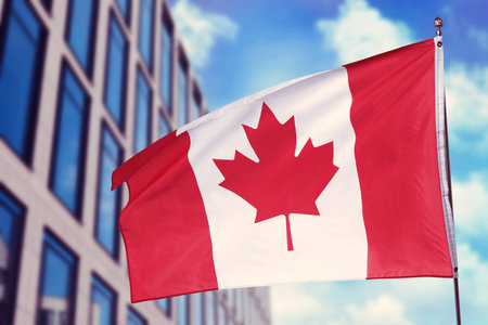 Flag waving against building outdoors.の写真素材