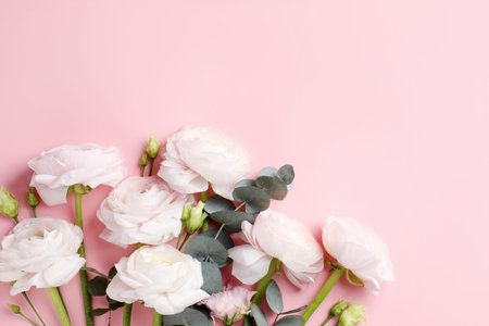 Beautiful flowers and on pink background, flat lay. Space for text