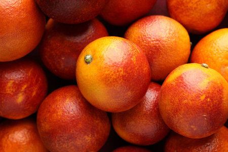 Ripe Sicilian oranges as background, top viewの写真素材