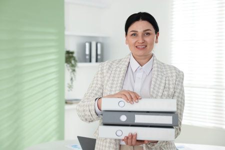 Professional accountant with folders in office, space for text