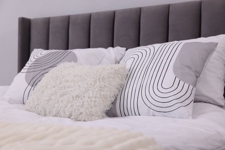 Bed with beautiful clean lines indoors, closeup