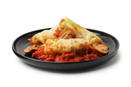 Yummy stuffed cabbage rolls with mushrooms and tomato sauce isolated on whiteの写真素材