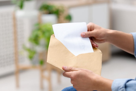 Man with letter from university at home, closeup. Space for text