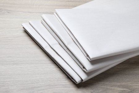 Newspapers on wooden table, closeup. Mockup for design