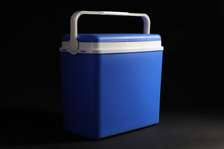 One cool box on black background, closeup