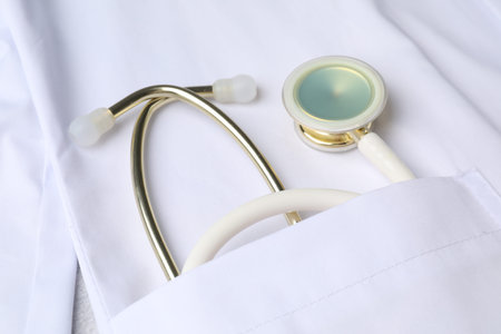 Doctor's white coat with stethoscope, closeup view