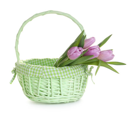 Beautiful flowers in wicker basket on white backgroundの写真素材
