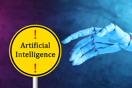 Robot hand pointing at warning sign with text Artificial Intelligence. Colorful backgroundの写真素材
