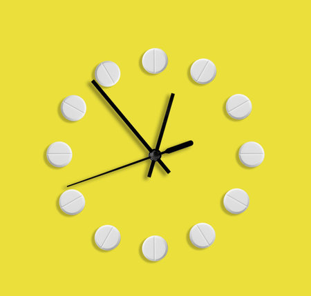 Creative clock design with pills on yellow background