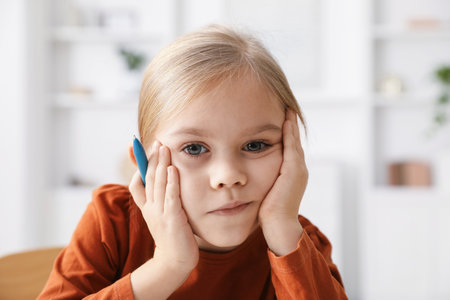 Portrait of little girl feeling fatigue indoors