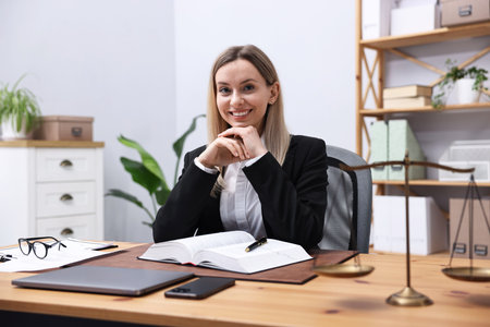 Portrait of notary at wooden desk in office
