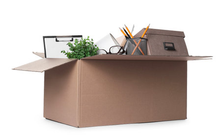 Dismissal. Box of personal office belongings isolated on white