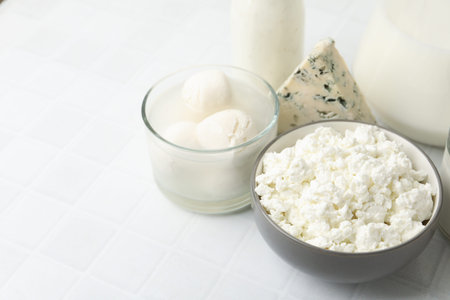 Different dairy products on white tiled table, closeup. Space for textの写真素材