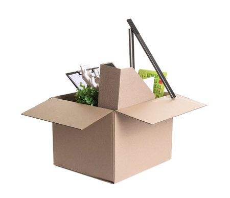Dismissal. Box of personal office belongings isolated on white